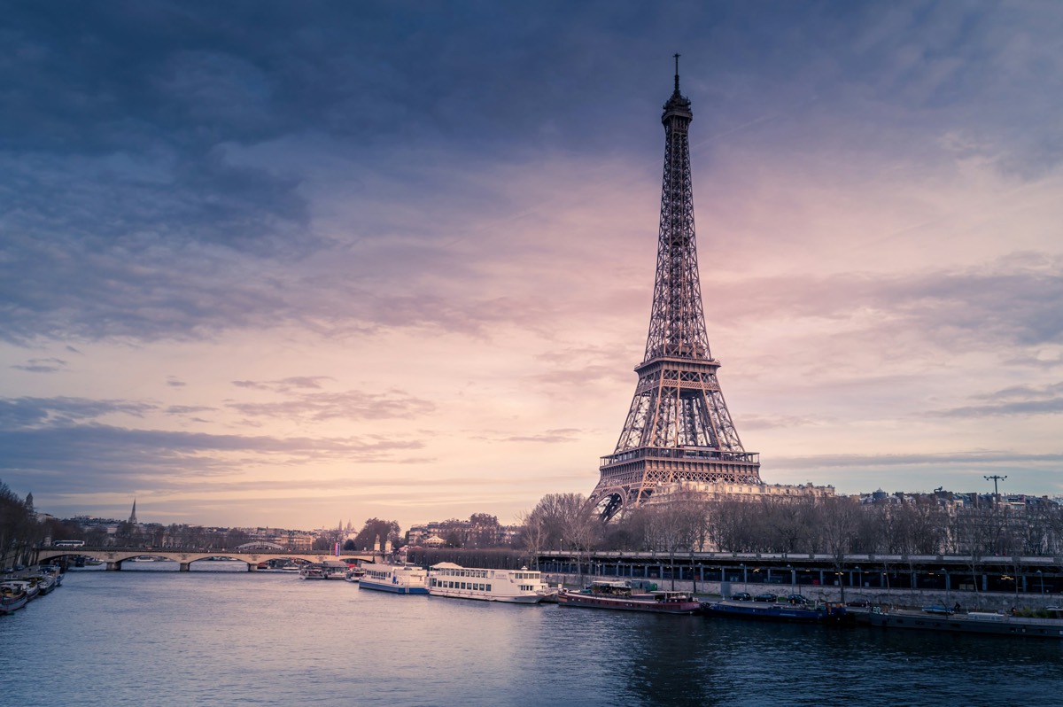 The Eiffel Tower over the Seine at dusk
